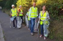 Photo of volunteers collecting litter by a canal