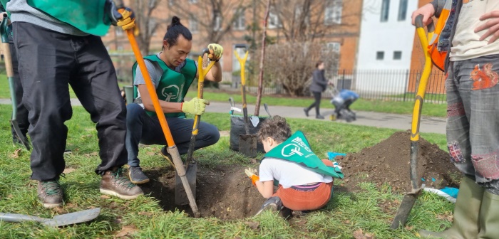 Photo of volunteers planting a tree